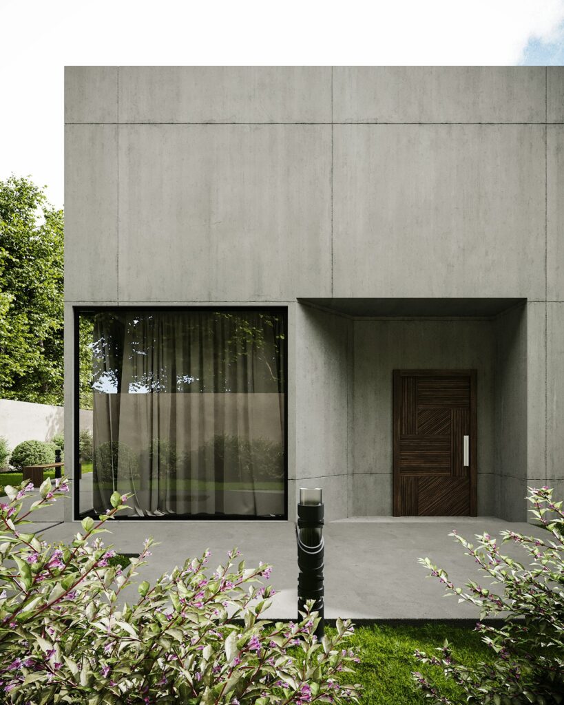 Fachada de hormigón visto con gran ventanal y puerta de madera
